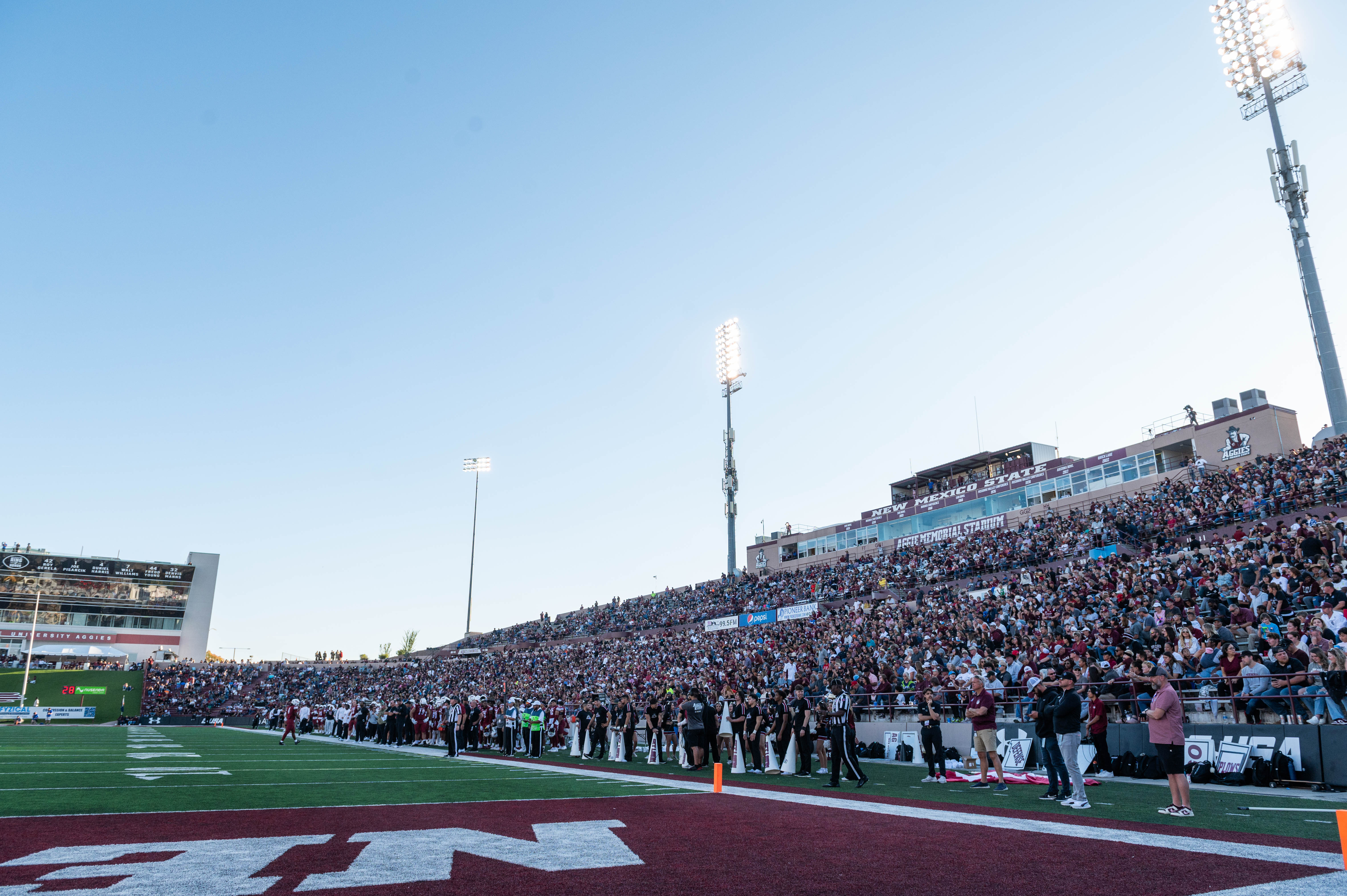 Home sideline crowd at the NMSU 2023 Homecoming Game at Aggie Memorial Stadium. 