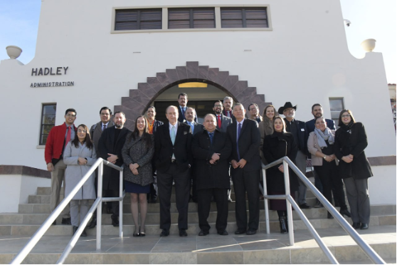 Representatives of NMSU and the Universidad Autonoma de Chihuahua stand for a photo outside Hadley Hall following a meeting dicussing collaboration. 
