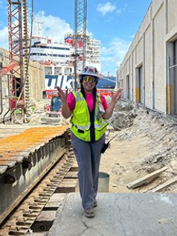 Diana Jaramillo in high vis gear on a construction site. 